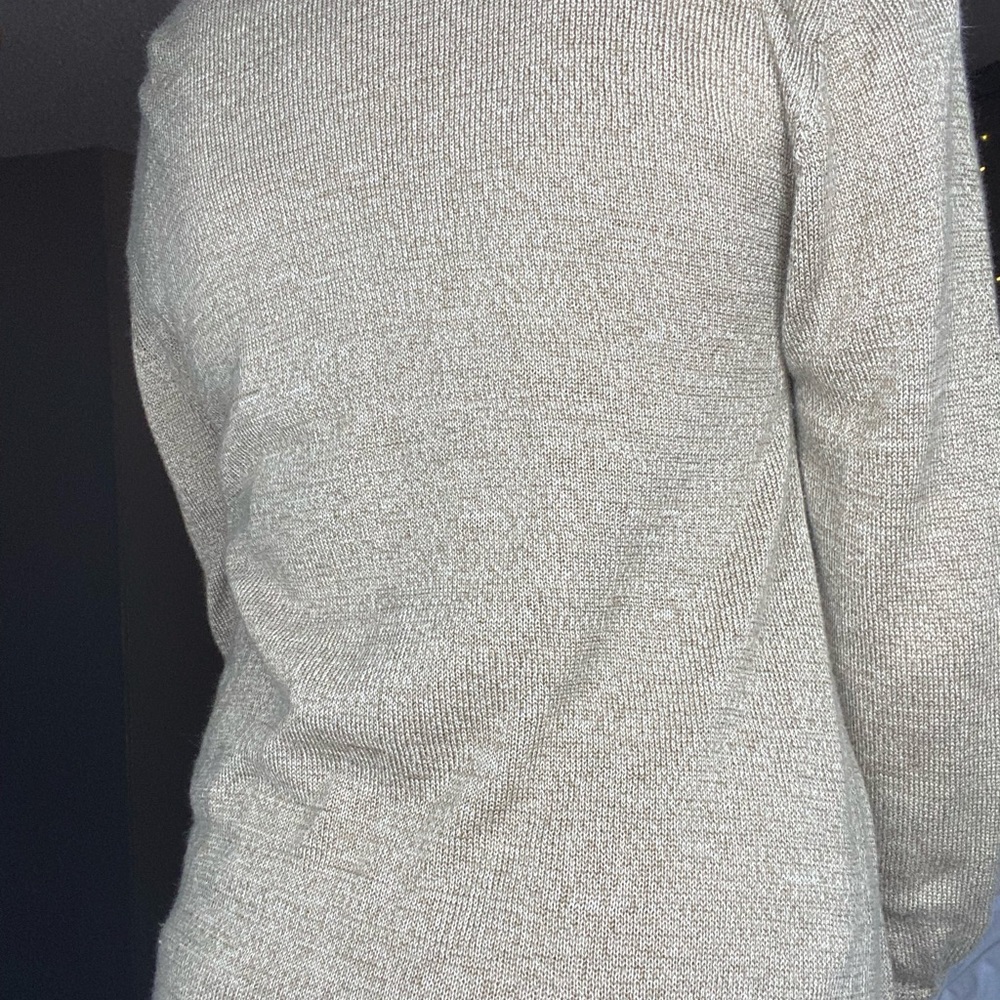 I’m selling this cream colored cardigan.